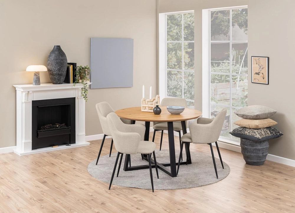 Court Round Dining Table in Oak Black Finish with Upholstered Beige Armchair and Pillow in Dining Setting