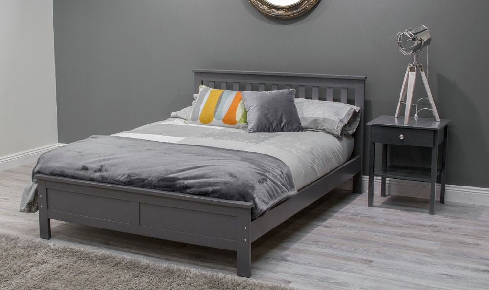 Jade Double Sized Bed with Pillows and Floor Rug in Bedroom Setting