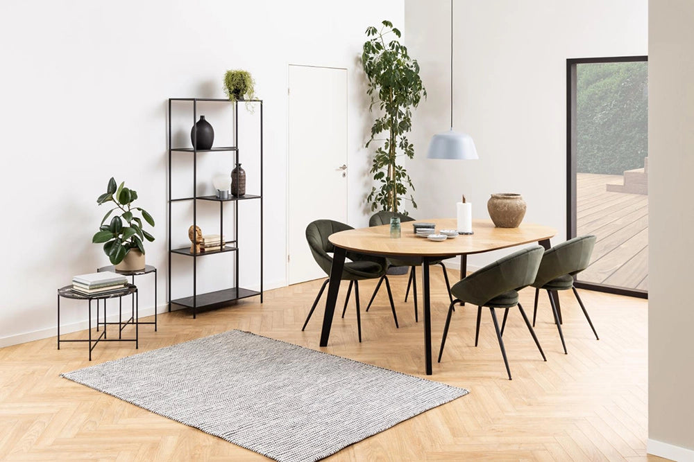 Mahon Extending Dining Table in Matte Oak Finish with Coffee Table and Indoor Plant in Dining Room Setting