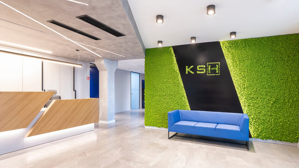 Verso-Upholstered-3-Seater-Sofa-in-Blue-Finish-with-Reception-Counter-in-Office-Lobby-Setting.webp
