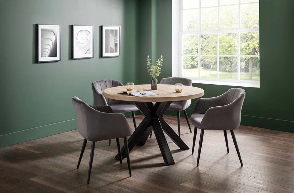 Burnwick Round Dining Table with Dining Armchair and Wall Frame in Breakout Setting