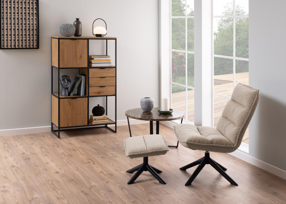 Ramble Round Coffee Table in Brown Marble Finish with Lounge Chair and Bookshelves and Living Room Setting